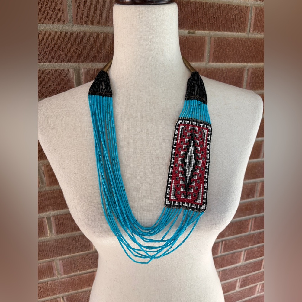 Beaded necklace with silver beaded, accents and clasp.